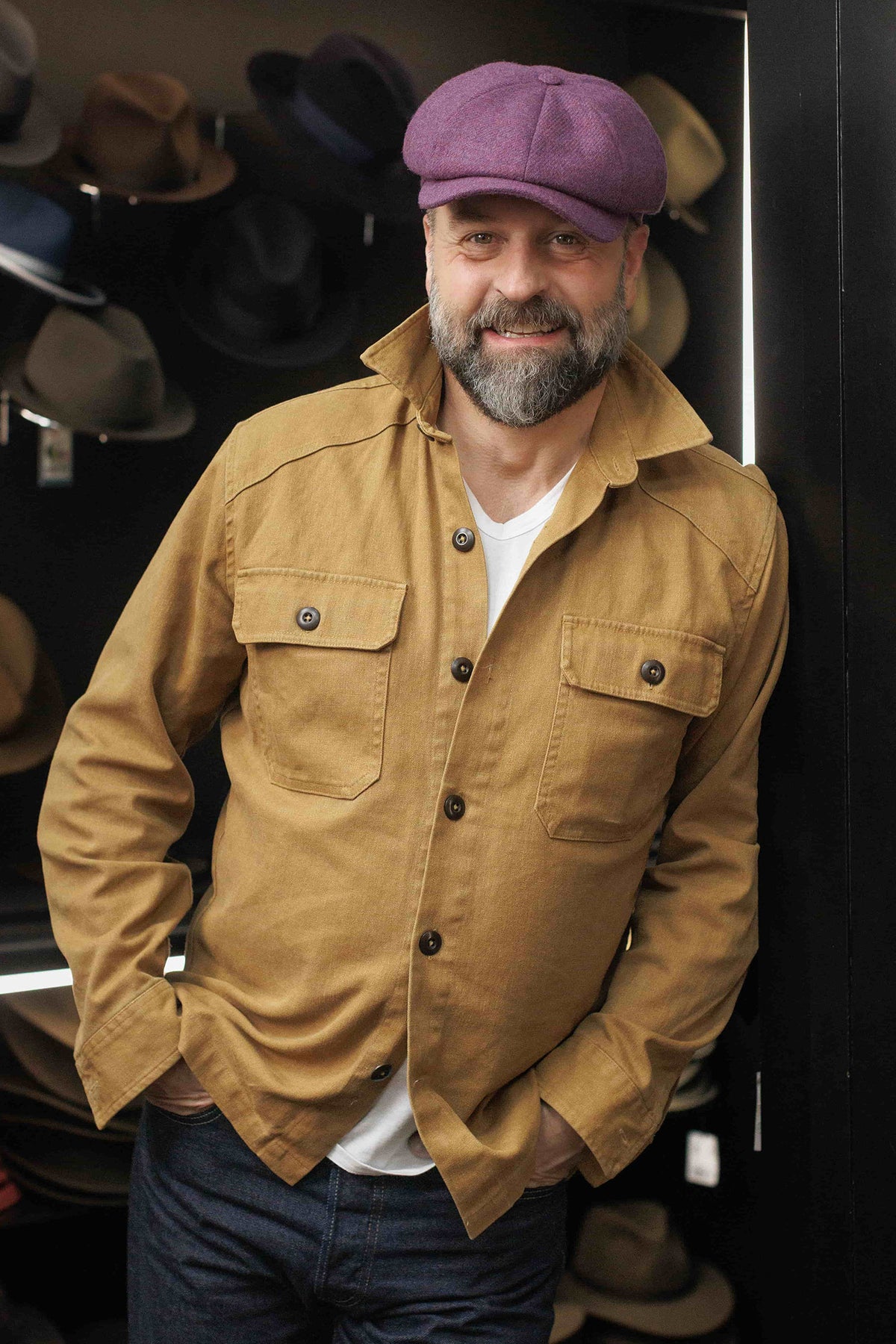 Alfie Boe wearing a Lock & Co. Hatters purple newsboy wool cap.