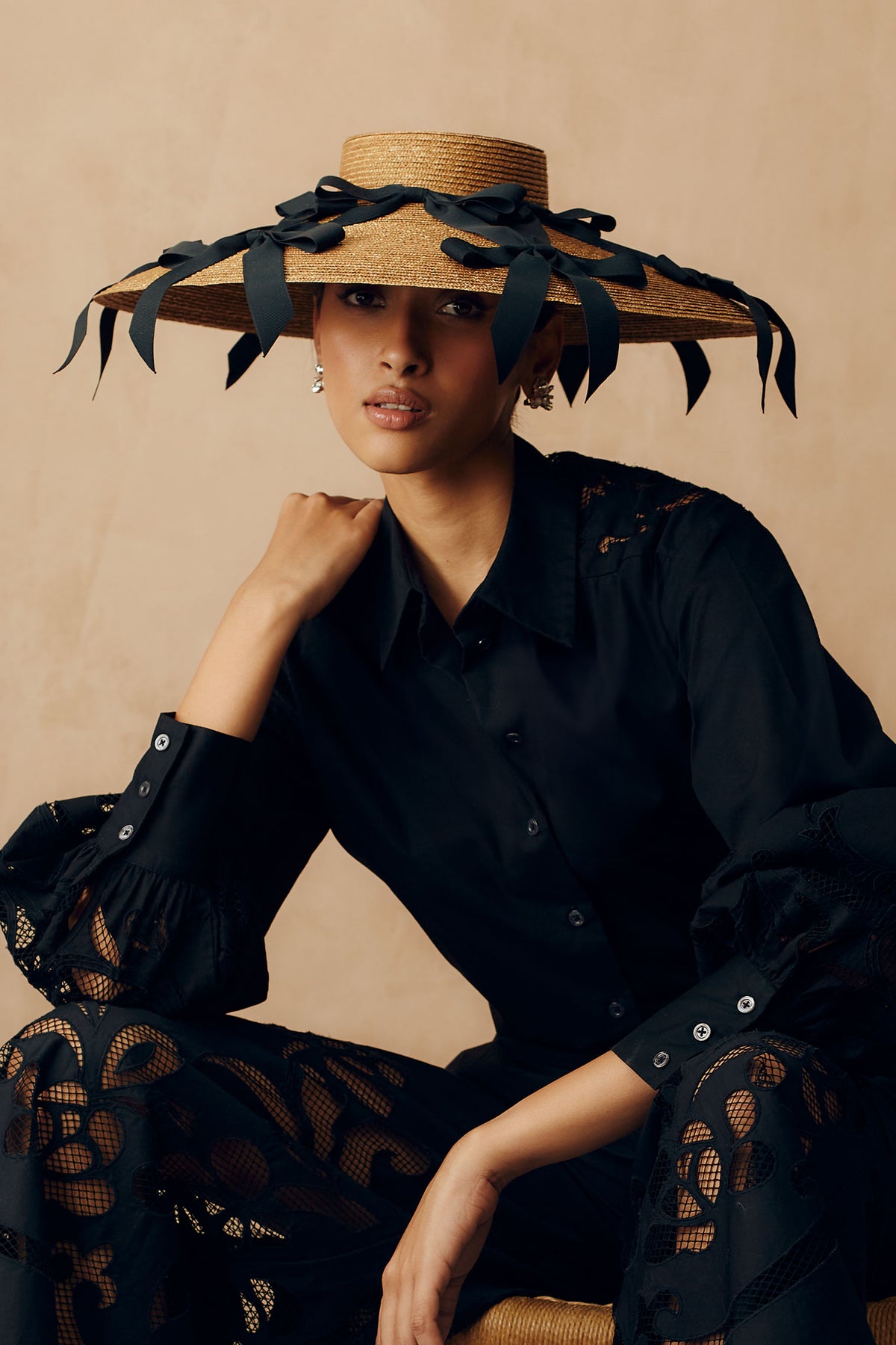 Golden wide brim percher with black grosgrain ribbons