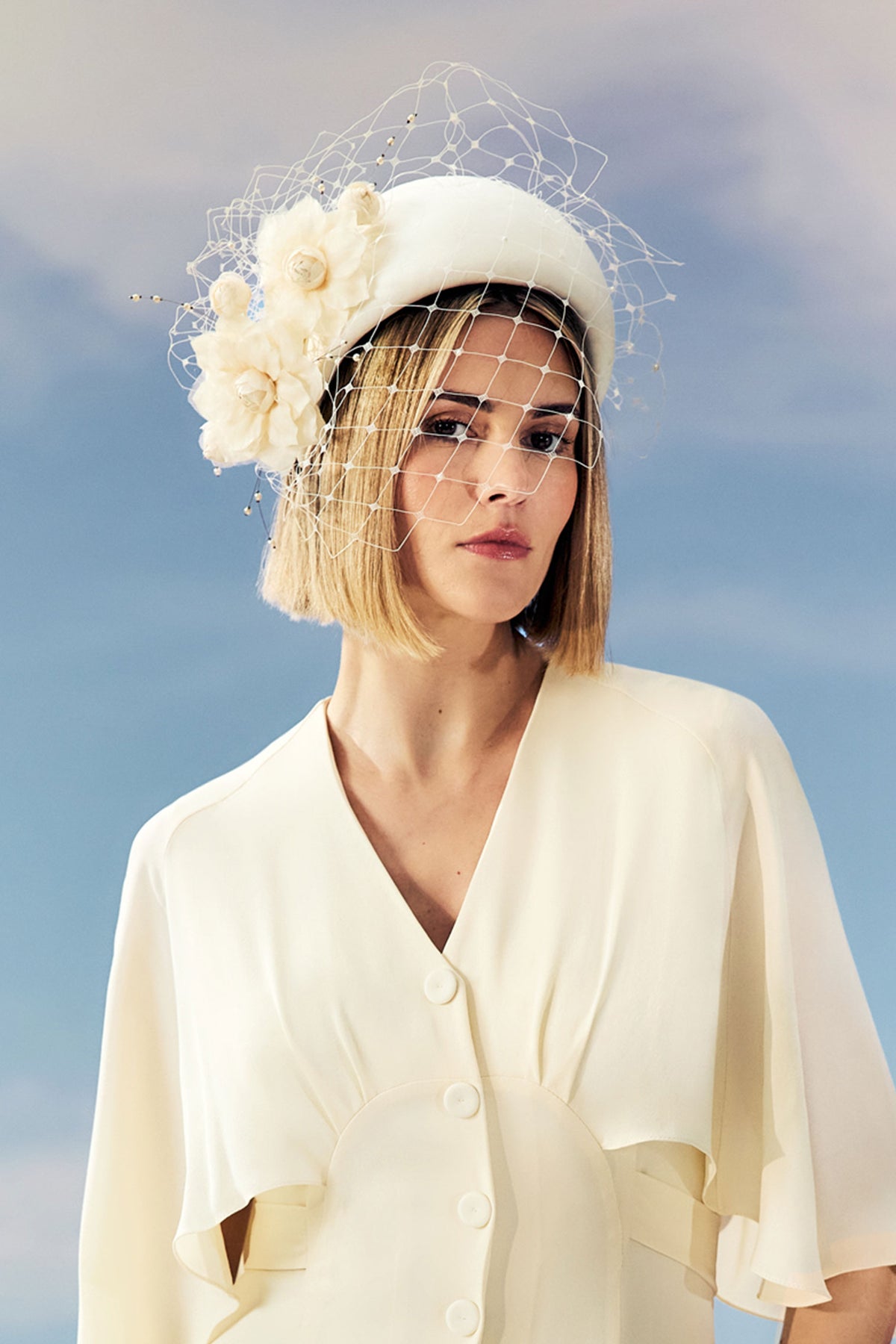 Women's yellow silk dupion headband with sculptural gardenia flowers and veil.