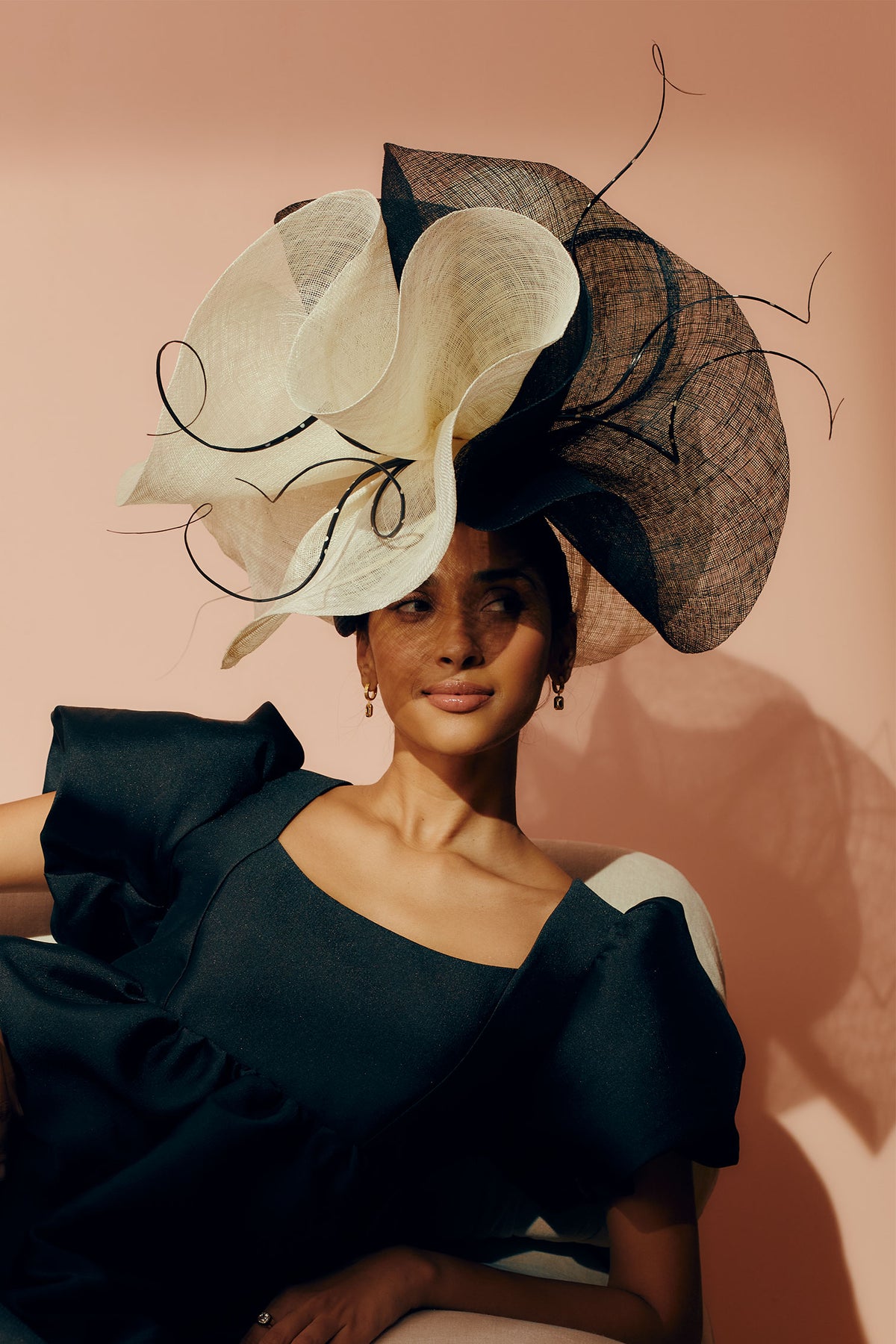 Oversized black and white teardrop percher in parasisal straw