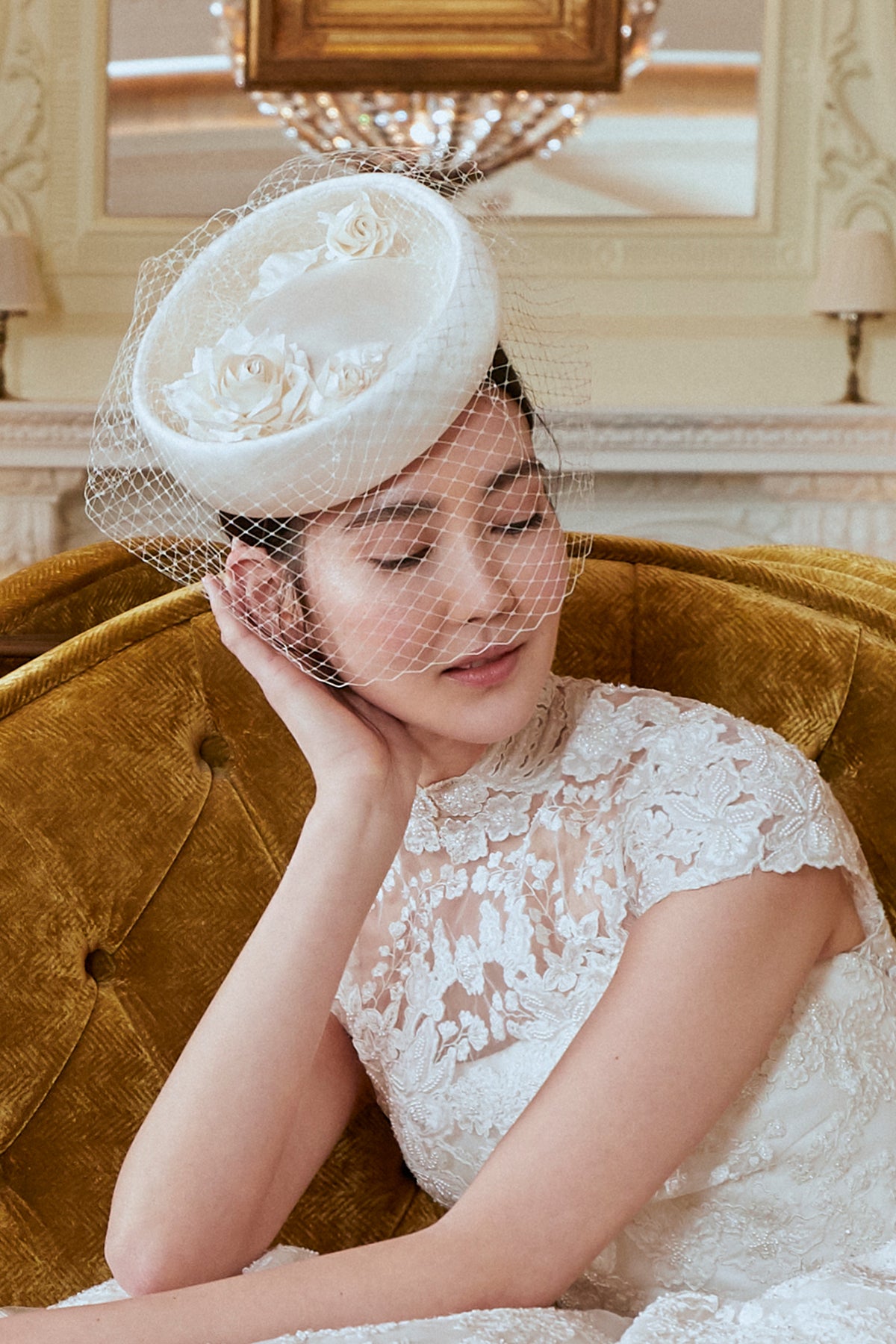 IVORY DUCHESS SATIN COVERED ROUND COUTURE HAT WITH ROSE DETAILING AND BIRDCAGE VEIL