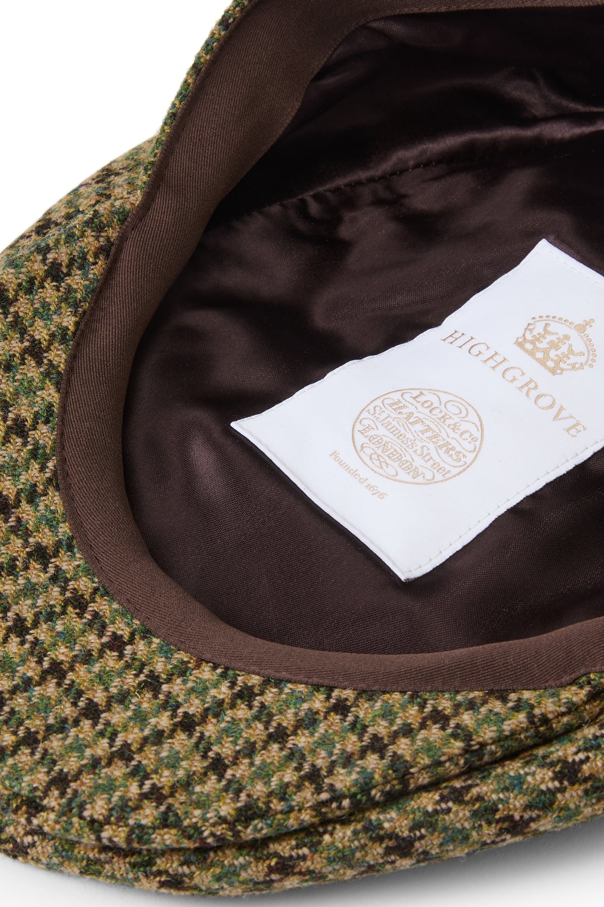 INSIDE OF GREEN AND BROWN CHECK WOOL TWEED FLAT CAP WITH HIGHGROVE LABEL