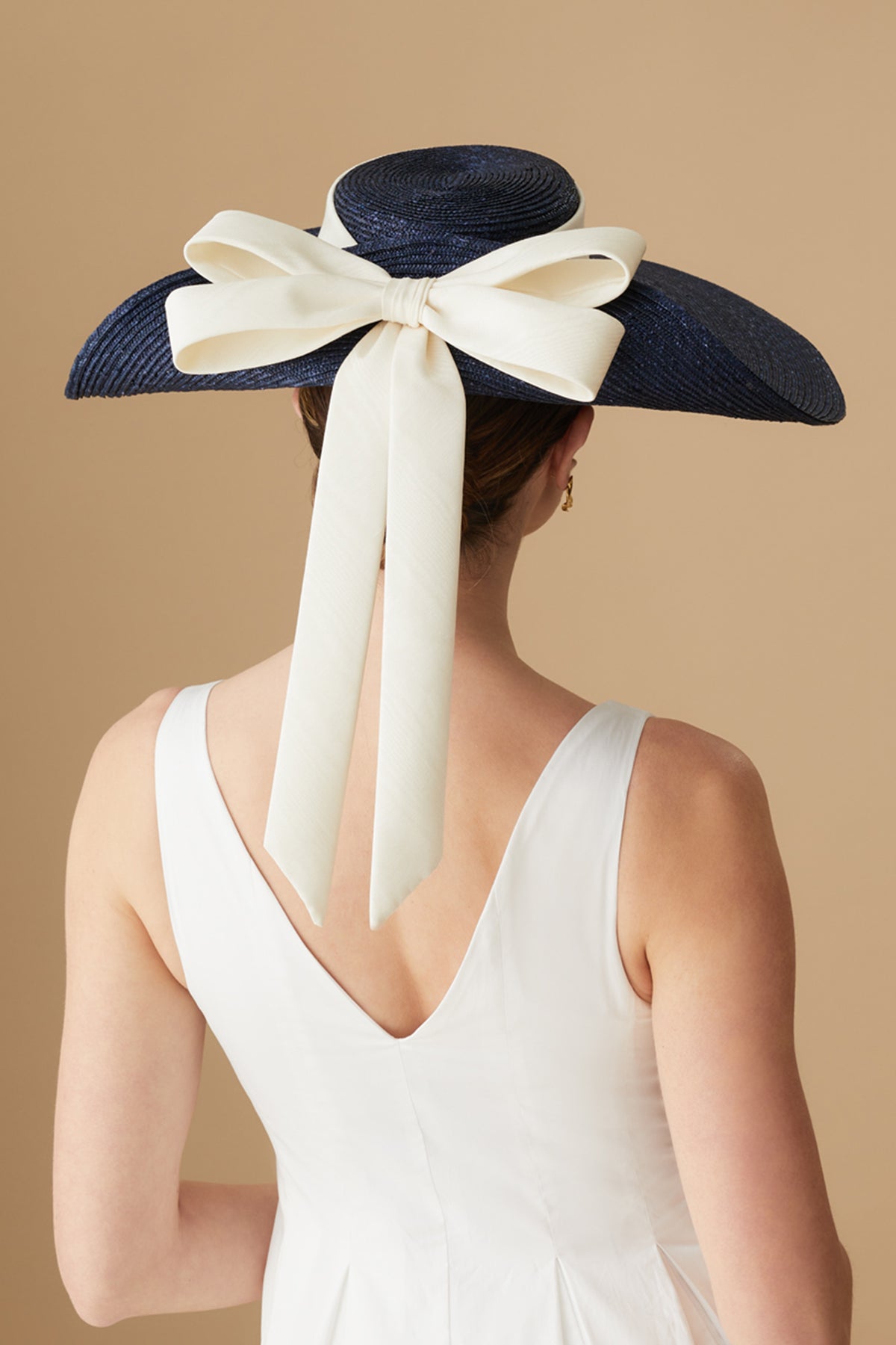 NAVY STRAW WIDE BRIM HAT WITH UPTURNED BRIM AND A SILK DOUBLE BOW