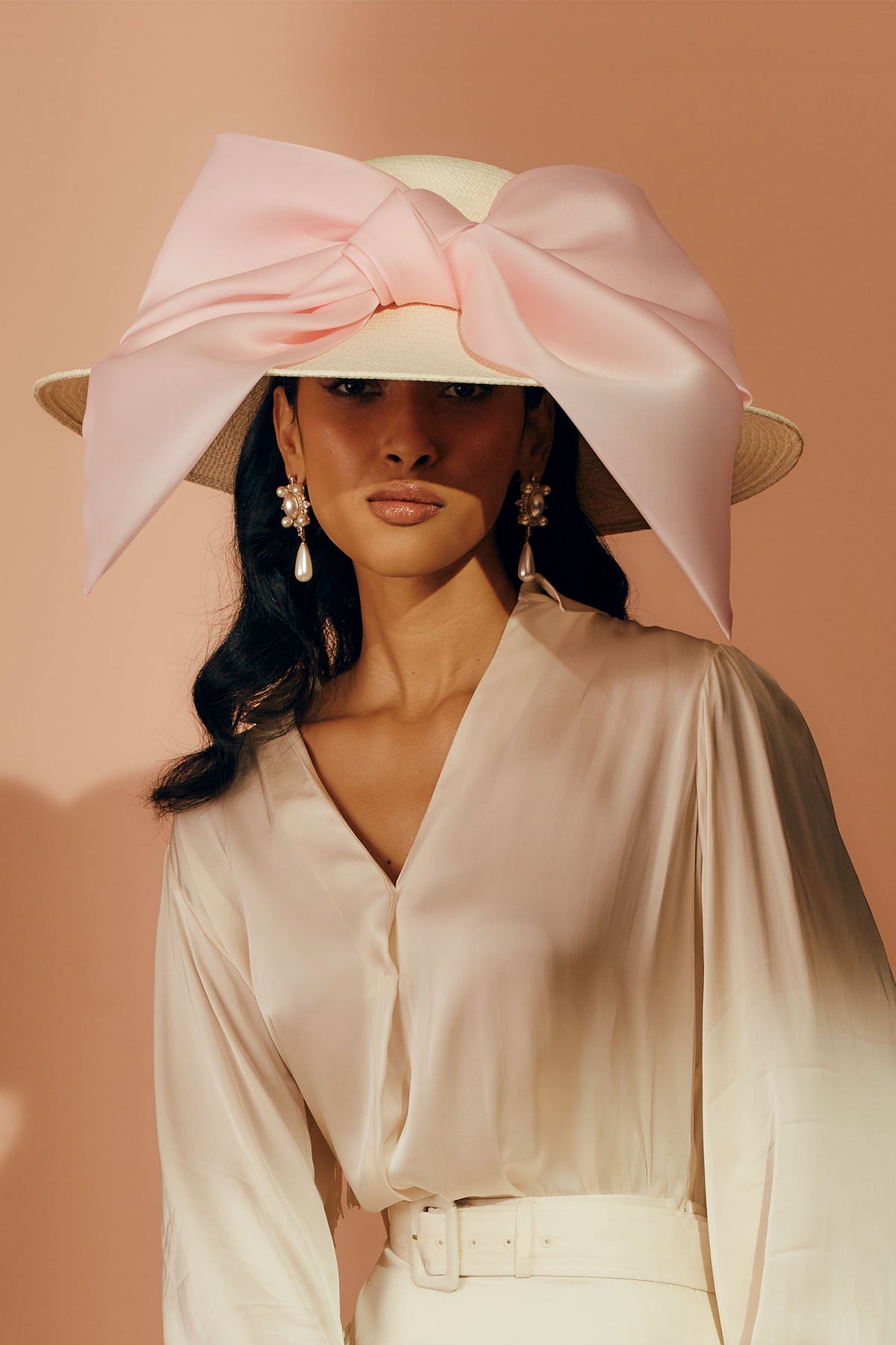 Ivory Panama straw wide-brim picture hat with an oversized silk gazor light pink bow