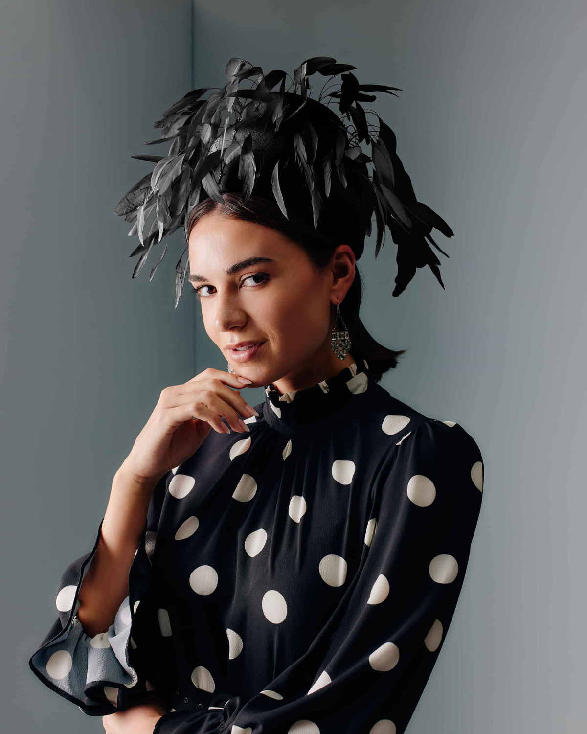 Couture black velour felt beehive shape headpiece with black feathers.