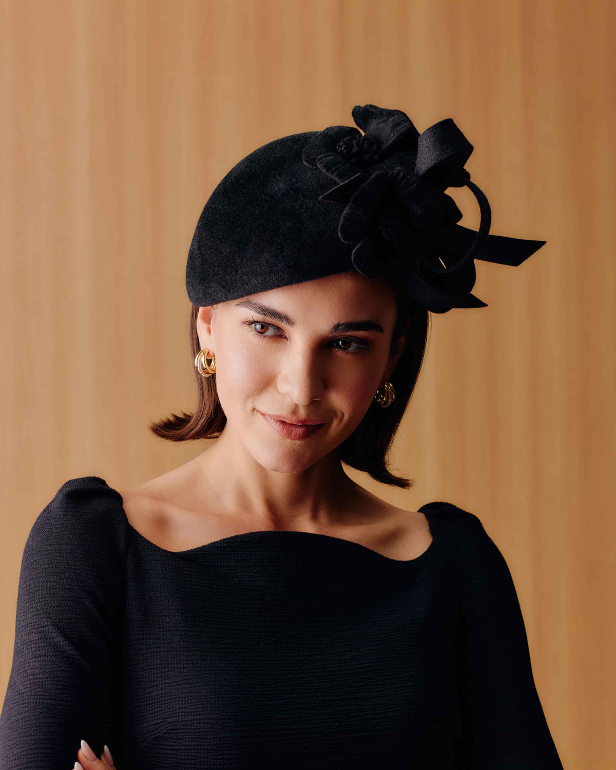 Couture black velour felt tear drop percher hat with three poppies.