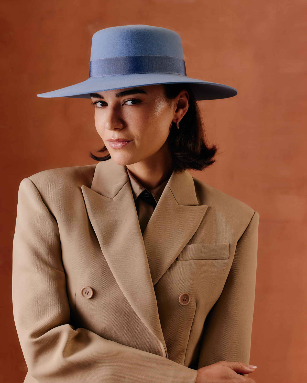 Women's wide-brimmed rabbit fur felt fedora hat in a muted slate blue color, featuring a matching fabric band.
