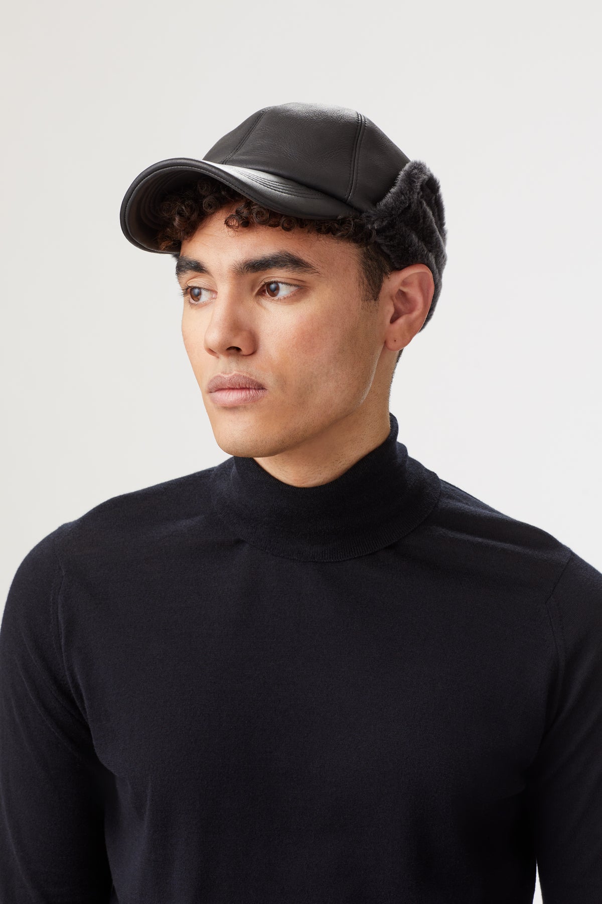 BLACK SHEEPSKIN BASEBALL CAP WITH FAUX FUR EXTERNAL EAR FLAPS