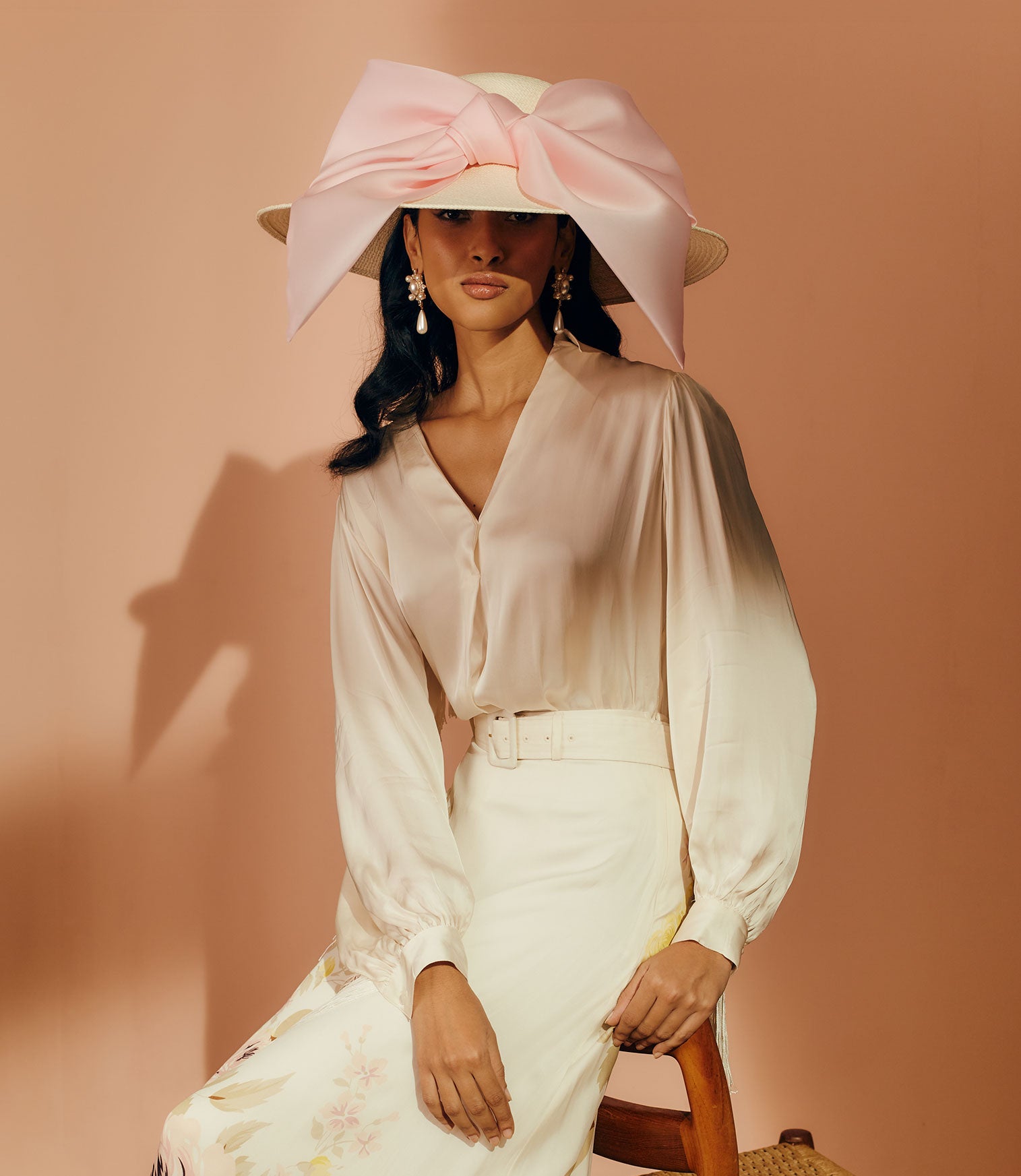 Ivory Panama straw wide-brim picture hat with an oversized silk gazor light pink bow