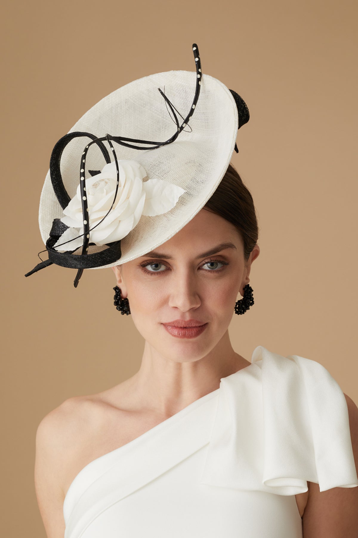 WOMEN&#39;S IVORY WHITE &amp; BLACK SINAMAY SAUCER HAT WITH POLKA DOT TWIRLING AND WHITE SILK CAMELLIA DETAILING
 - Lock & Co. Hatters London UK
            