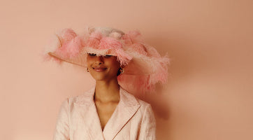 Pink sinamay wide brim hat with pink ostrich feathers