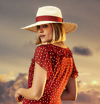 Women's scalloped edge natural straw Panama hat with a dark red ribbon