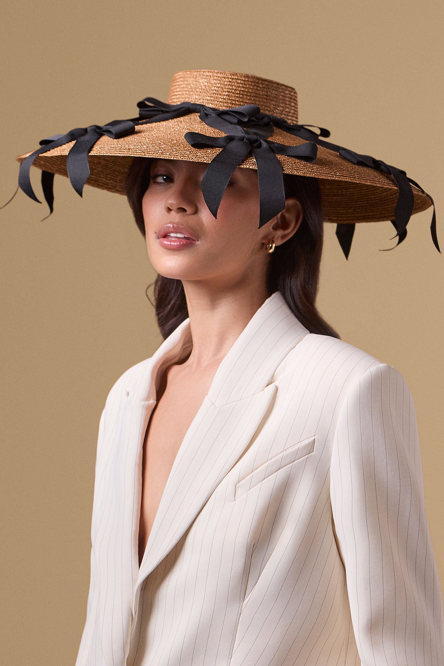 Golden and black wide brim pedal straw percher 