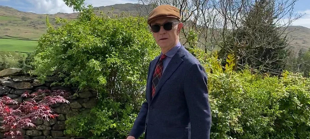 David Evans wearing the Lock & Co. Auric tan flat cap.