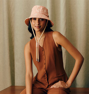 Coral floral motif bucket hat with cotton cords