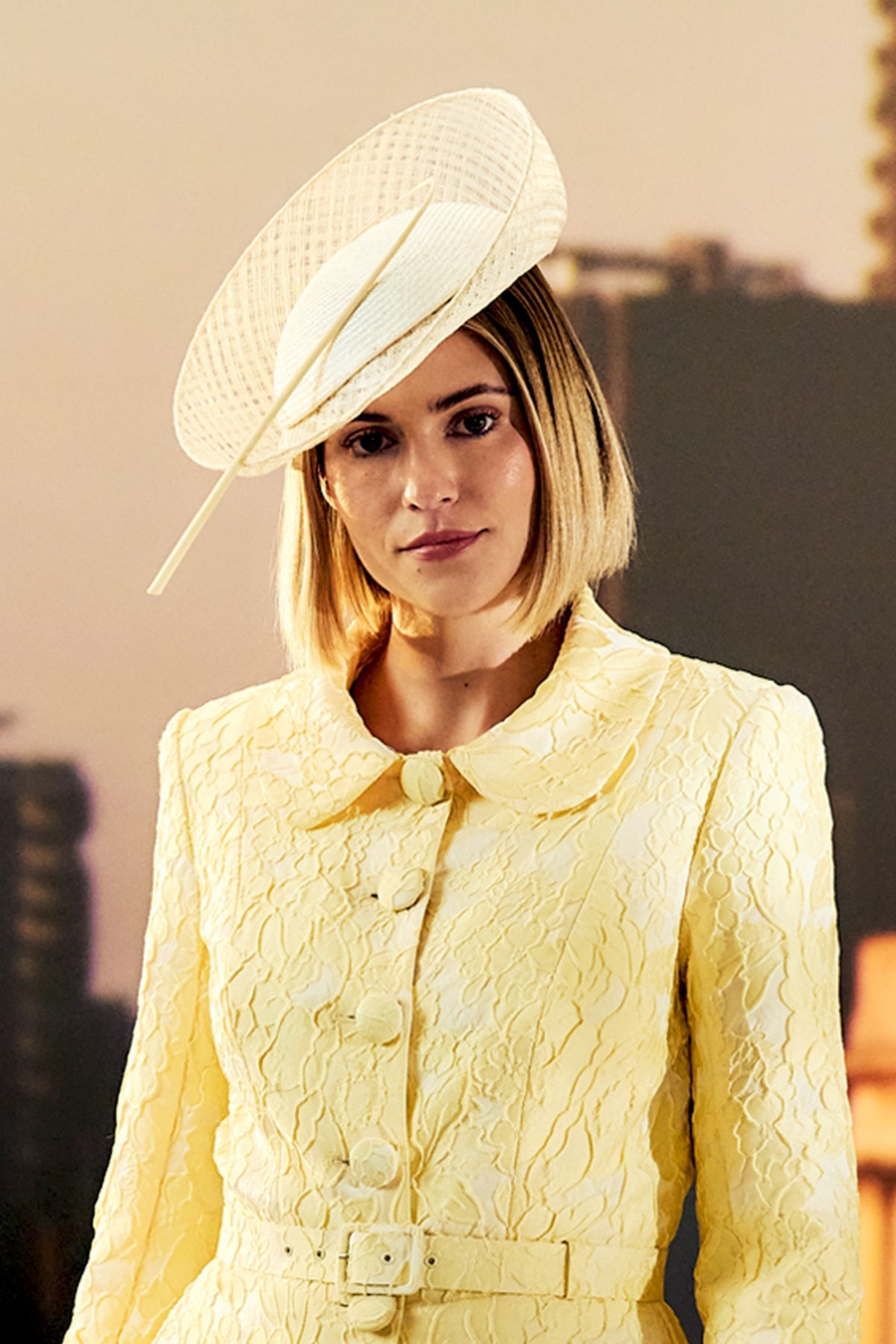 Women's ivory parasisal and mesh sinamay percher hat finished with a hand-curled striped ostrich quill.