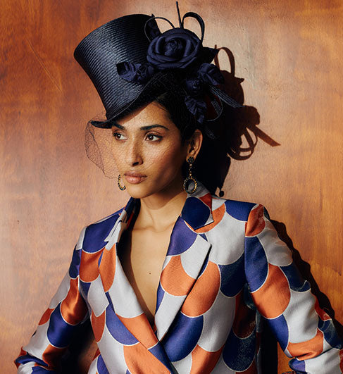 Navy parasisal straw top hat with vintage veiling, silk camellias & straw loops