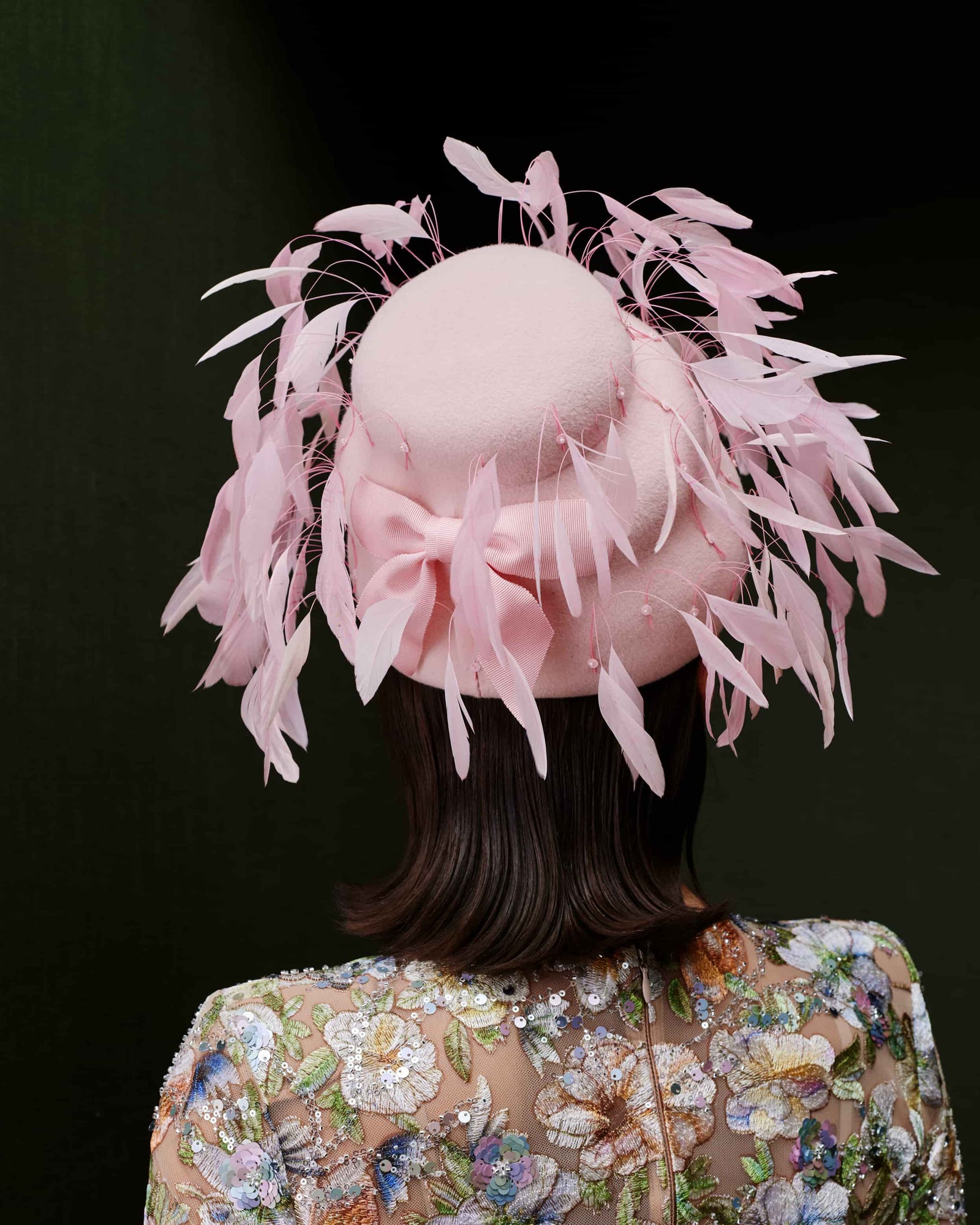 Couture pink velour felt beehive shape headpiece with pink feathers.