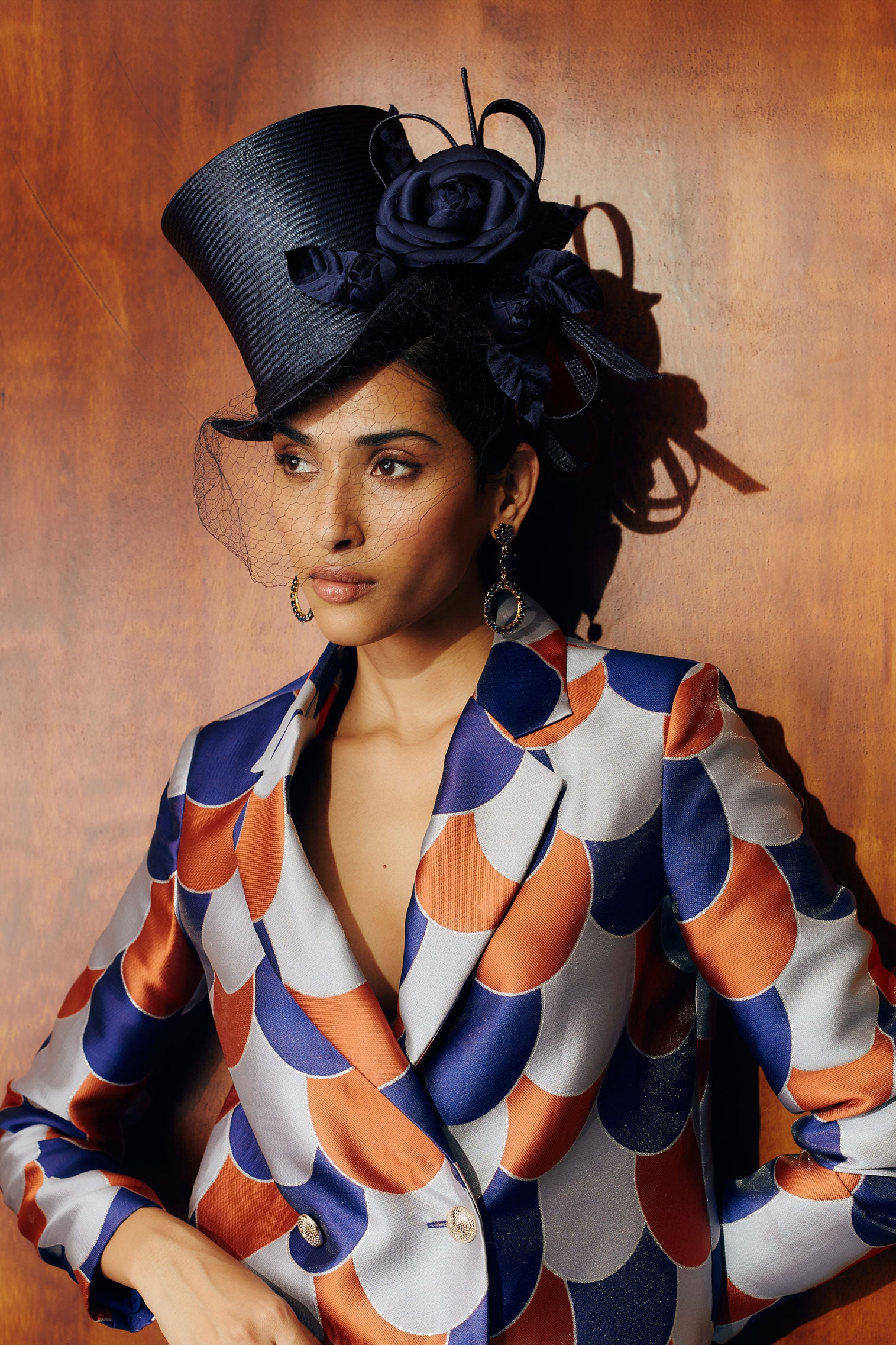 Navy parasisal straw top hat with vintage veiling, silk camellias & straw loops