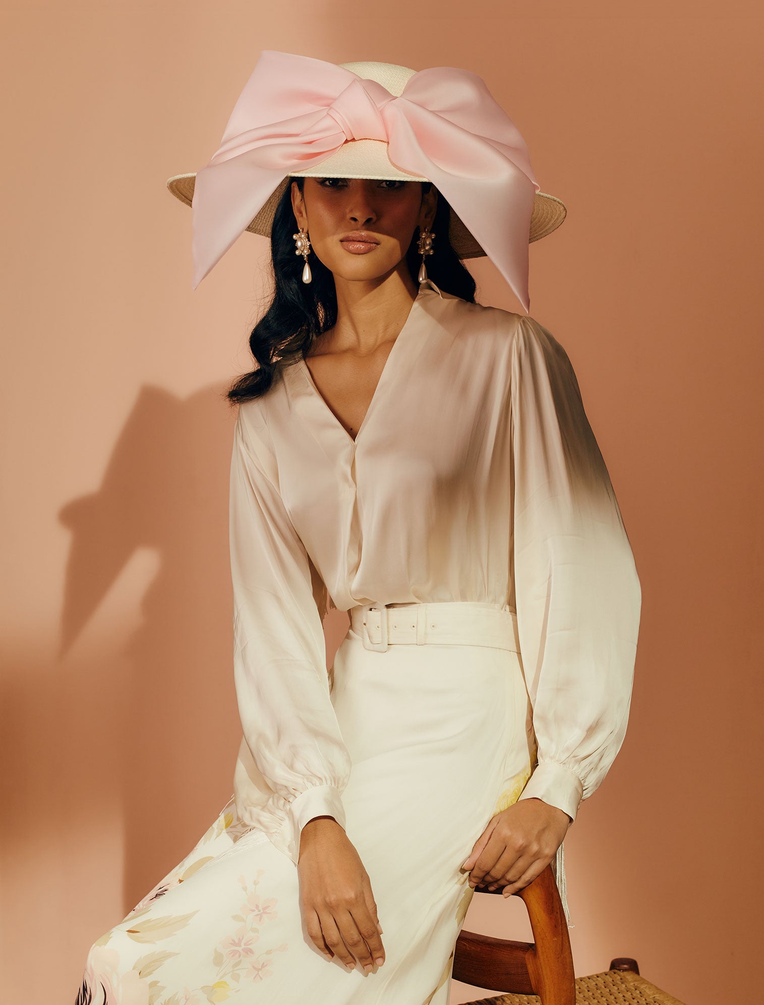 Ivory Panama straw wide-brim picture hat with an oversized silk gazor light pink bow