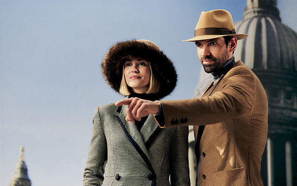 Men's ultrafine wool camel fedora hat with a brown grosgrain ribbon and bow. Women's estate beige tweed winter hat with a brown faux fur brim.