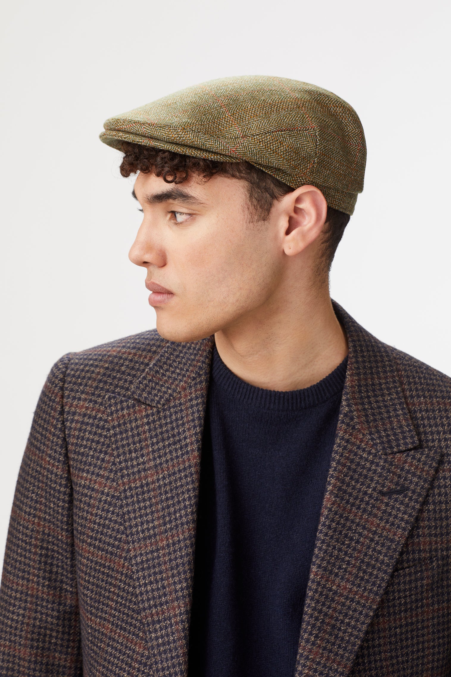OLIVE GREEN TWEED FLAT CAP WITH INTERNAL EAR FLAPS