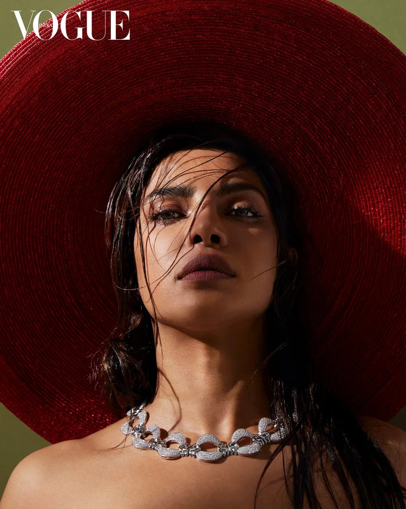 Priyanka Chopra wearing large red straw Lock & Co. Hat