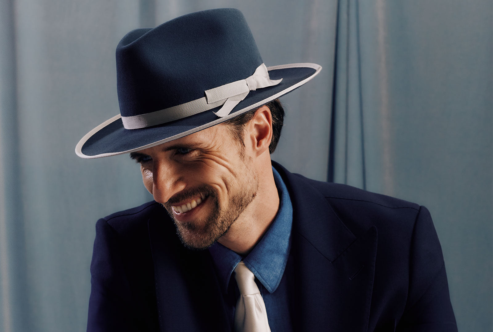 Steel blue rabbit fur felt fedora hat with a silver narrow band and bow