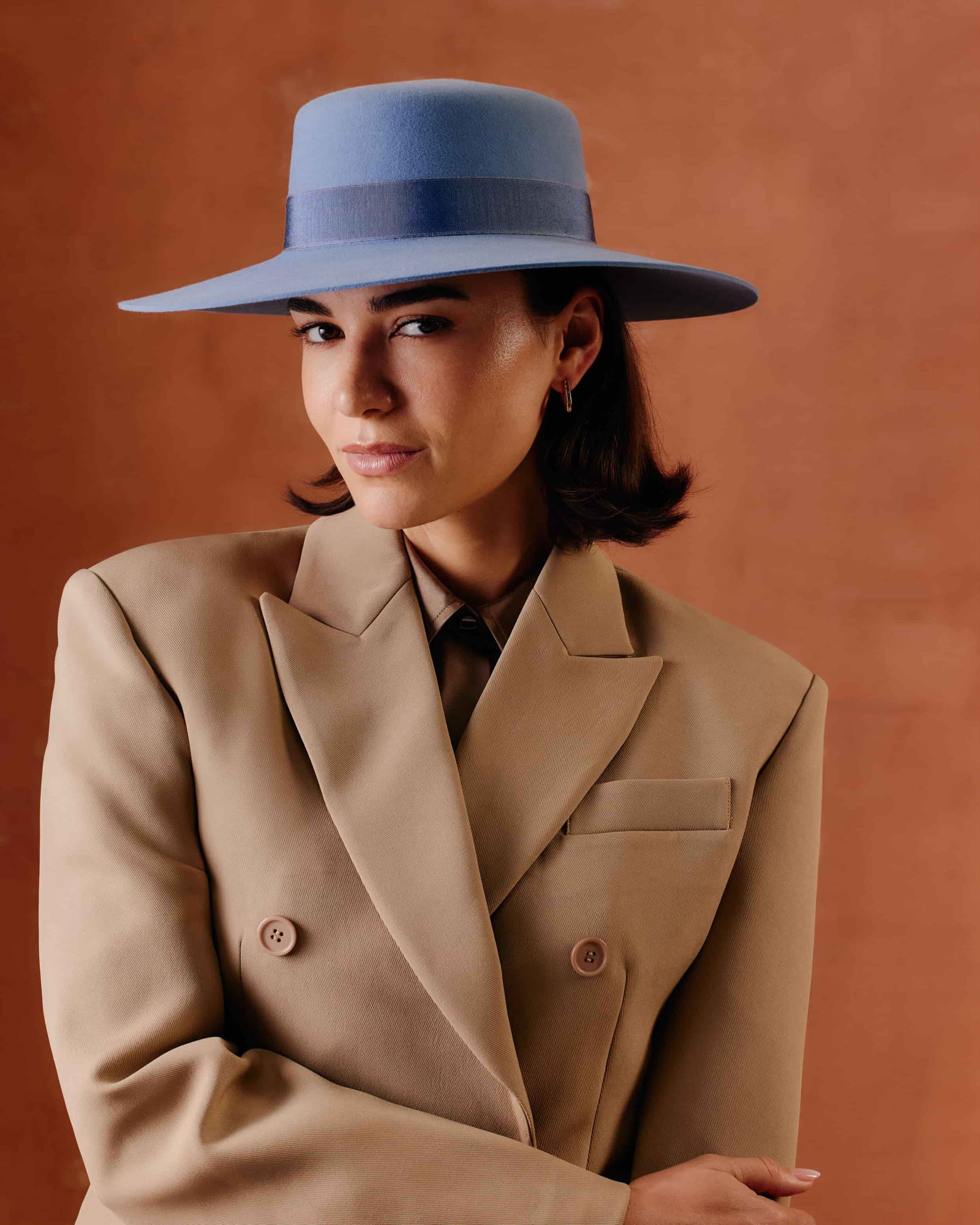 Women's wide-brimmed rabbit fur felt fedora hat in a muted slate blue color, featuring a matching fabric band.