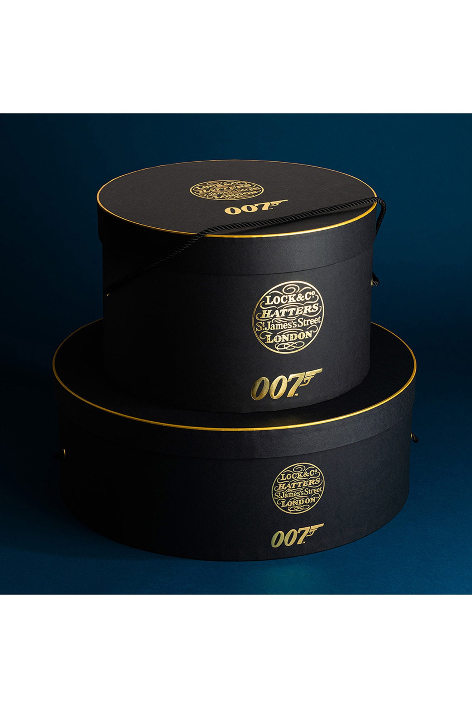 LOCK & CO. HATTERS X 007 HAT BOX IN BLACK AND GOLD