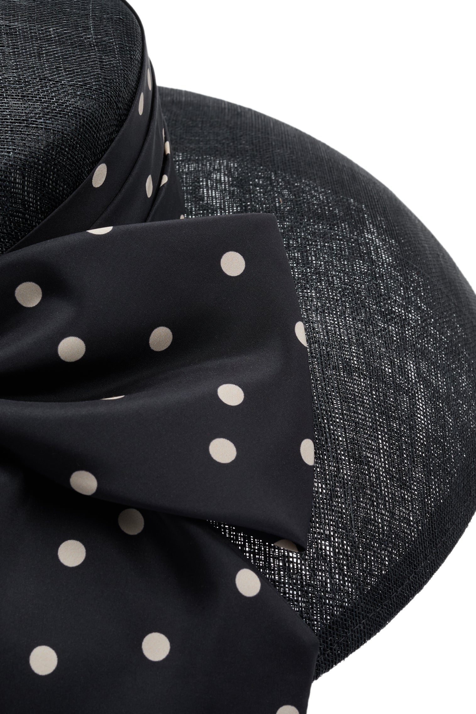 Polka dot puggery trimband and bow on a black sinamay drop brim hat