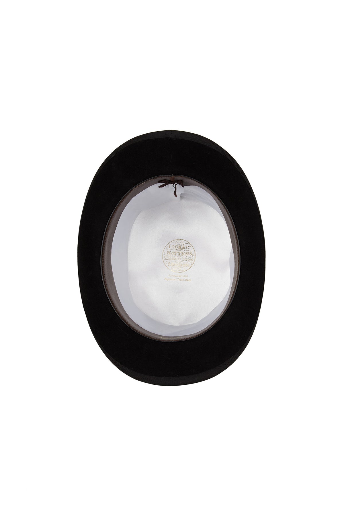 INSIDE OF BLACK FELT HIGH-CROWN TOP HAT WITH WHITE LINING AND GOLDEN LOCK &amp; CO. HATTERS LOGO - Lock & Co. Hatters London UK
            