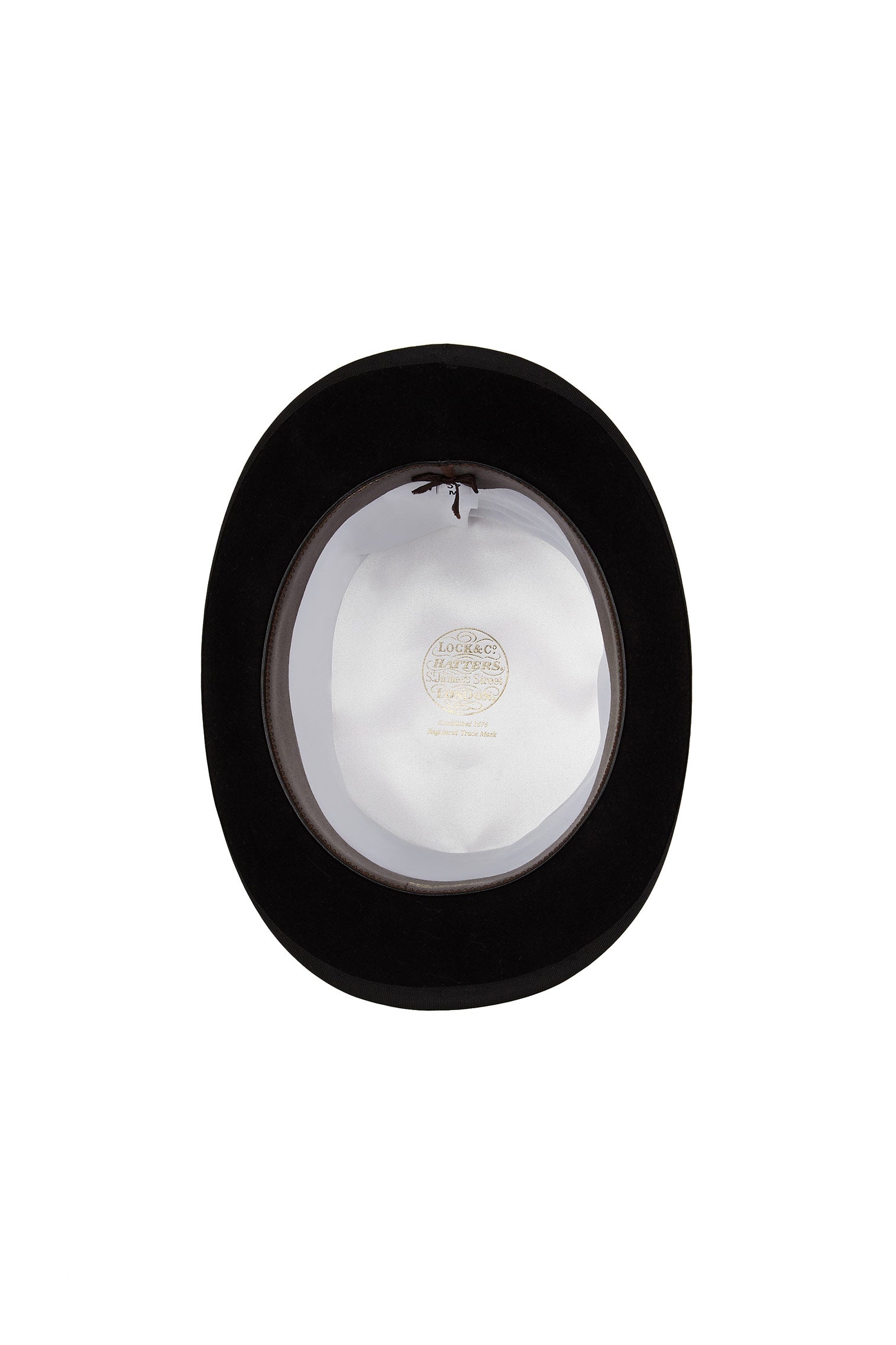 INSIDE OF BLACK FELT TOP HAT WITH WHITE LINING AND GOLDEN LOCK & CO. HATTERS LOGO