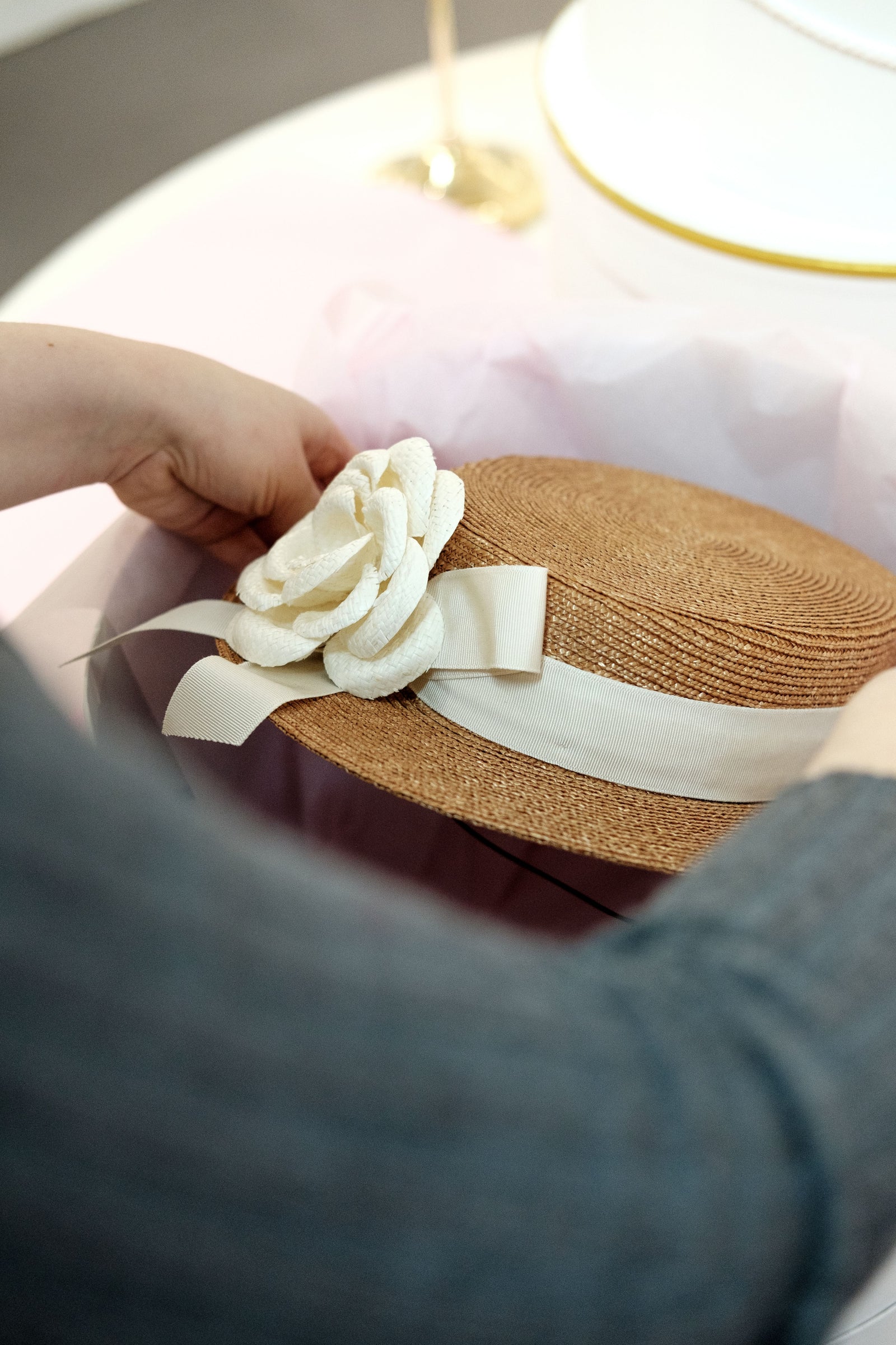 Couture Golden pedal straw boater hat with silk dupion rose and an ivory trimband and bow