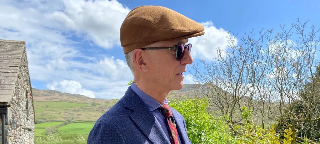David Evans wearing the Lock & Co. Auric flat cap.
